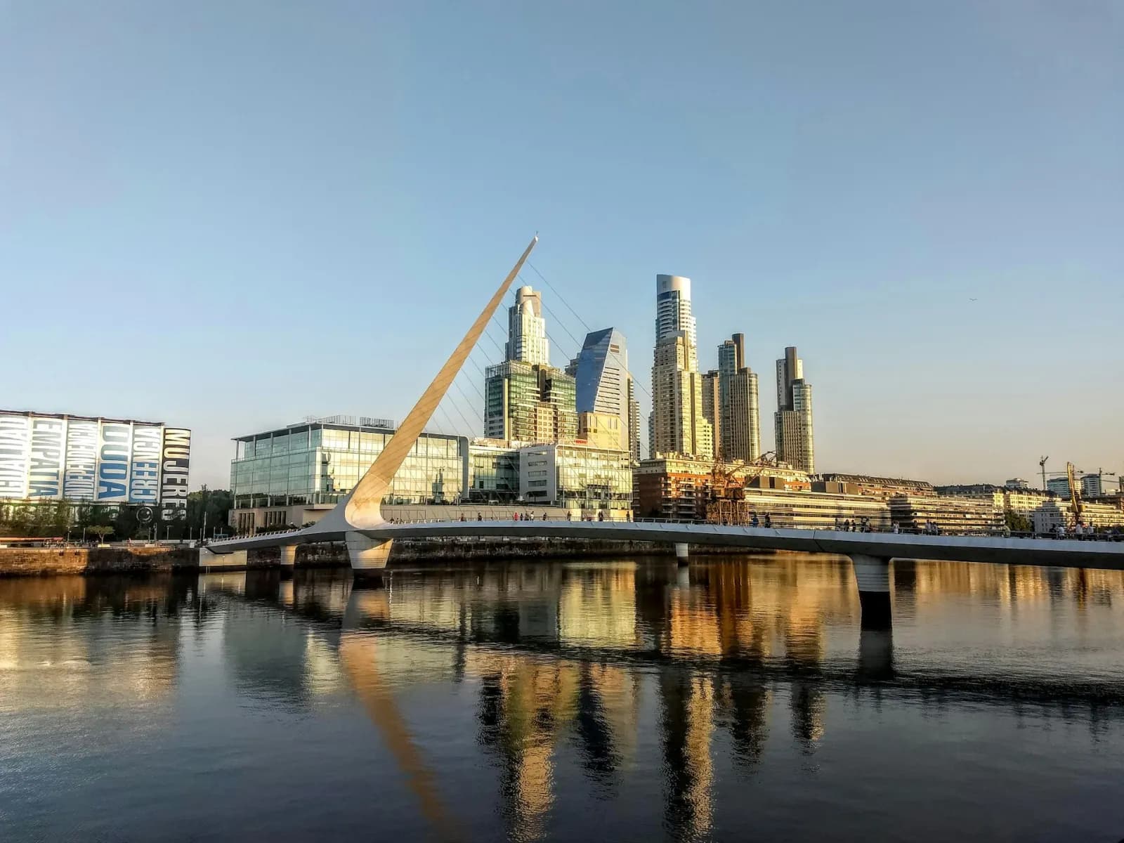 Puente de la Mujer footbridge over the water at Puerto Madero, Buenos Aires, at golden hour