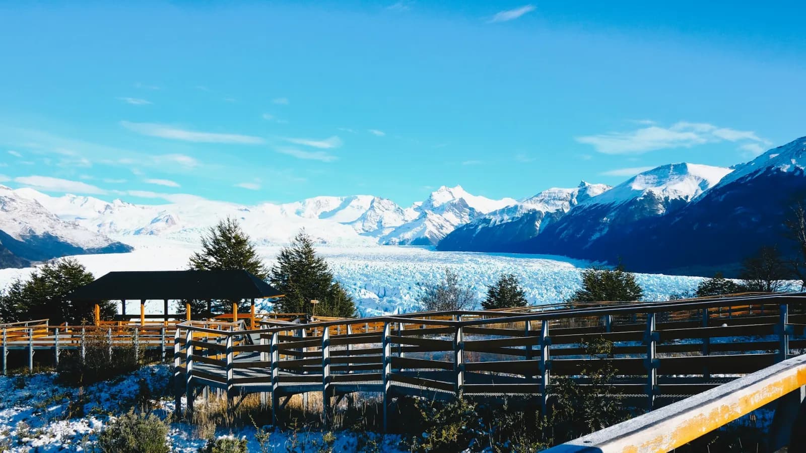 Boardwalk viewpoints facing the Perito Moreno Glacier and snow-capped Andes near El Calafate