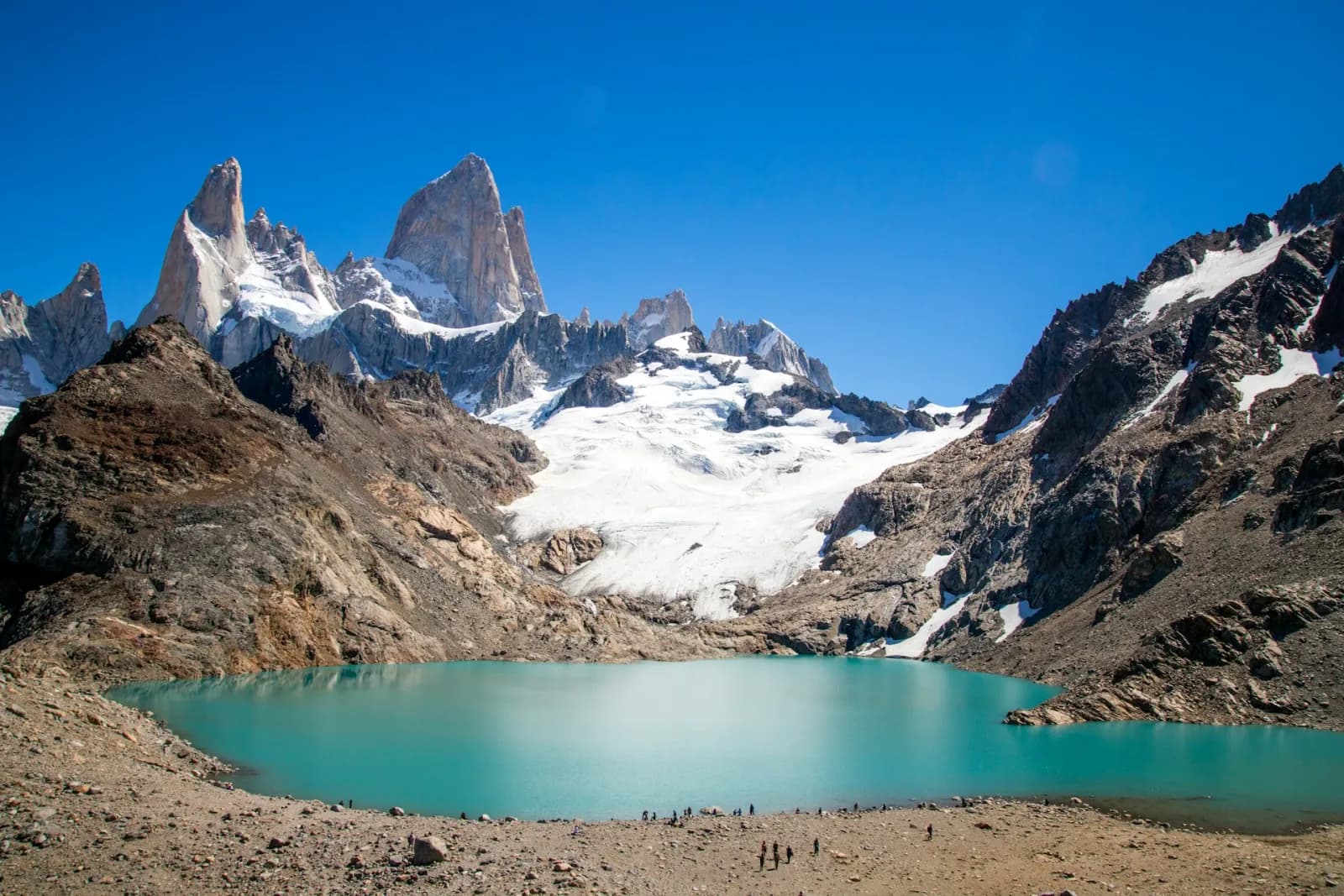 The granite spires of Mount Fitz Roy above the turquoise Laguna de los Tres near El Chaltén