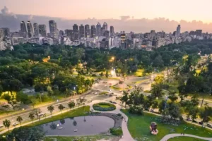 Aerial view of lush green parks and city skyline in Buenos Aires at dusk