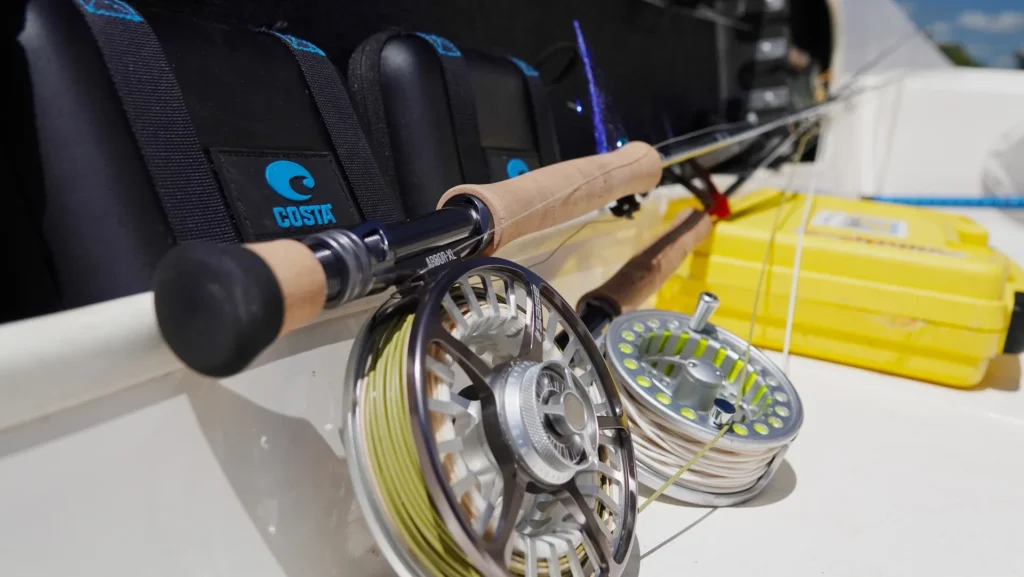 Close-up of Sage fly rod and reel with yellow line prepared for fishing on the boat